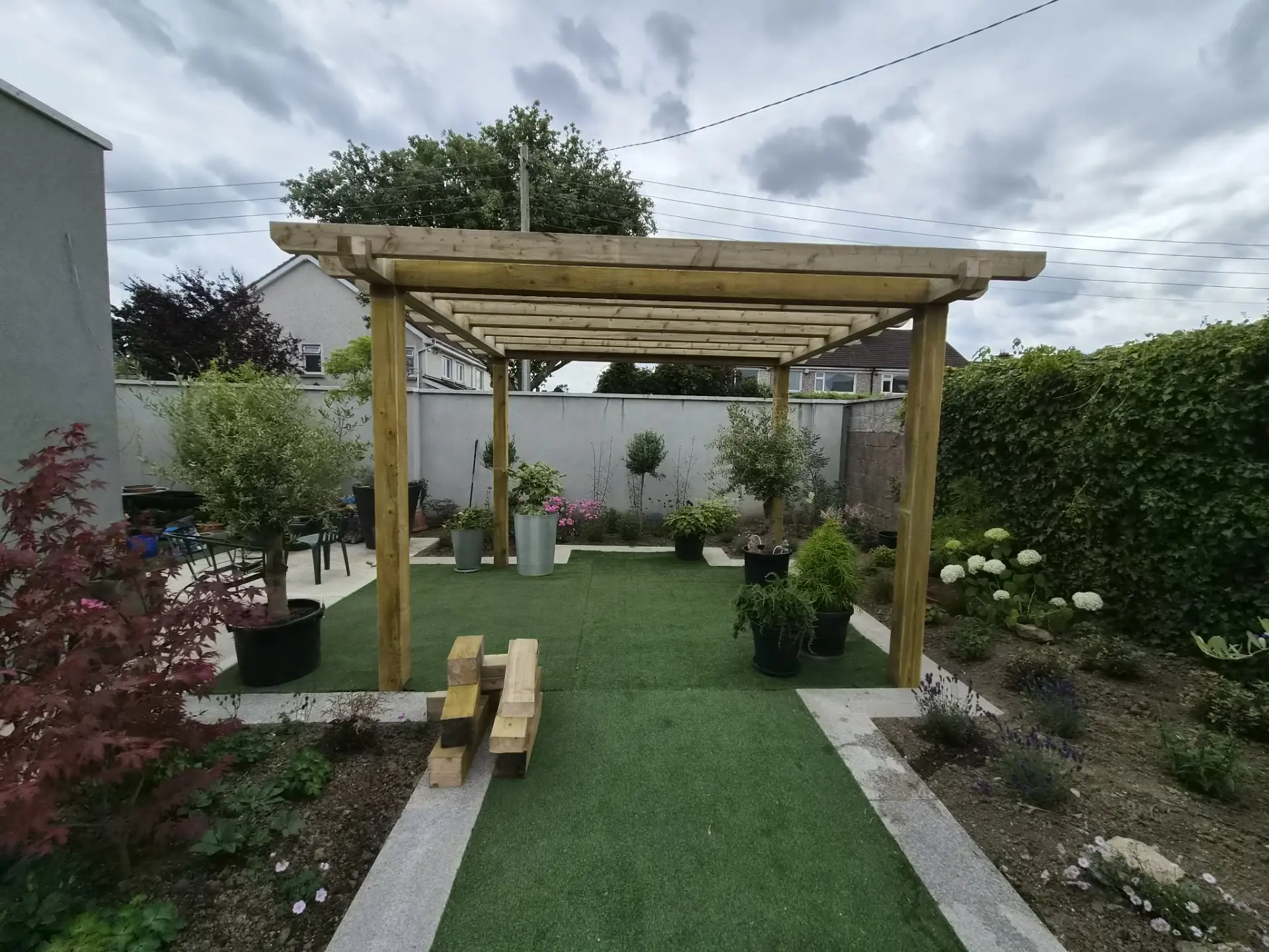 Timber pergola built over a landscaped garden patio in Dublin