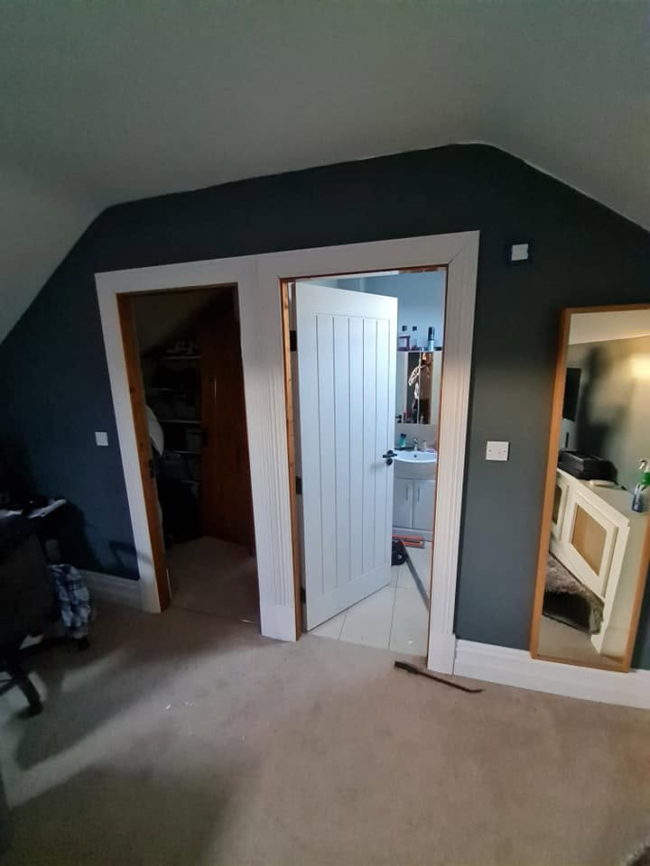 Refurbished attic bedroom with new doors, architrave and painted walls
